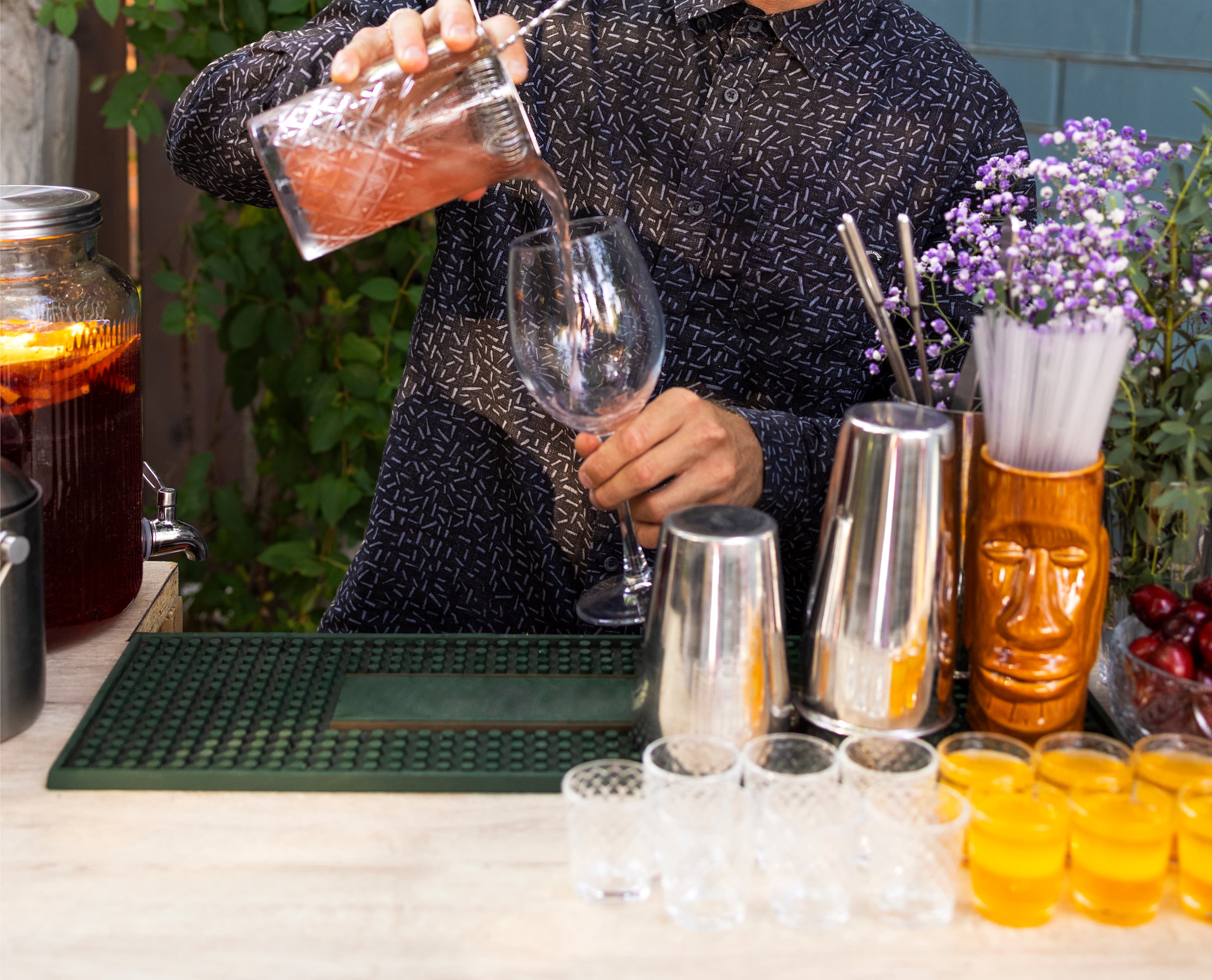 Bartender pouring craft cocktails